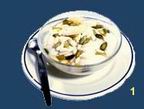 Mouhalabieh: Firm and milky pudding, topped with orange blossom jam and pistachio.