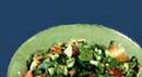 Fattouch: Medley of fresh vegetables served with tangy lemon dressing and topped with crisped bread