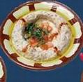 Moutabal: Broiled eggplant, blended with tahini and lemon. Topped with extra virgin olive oil.