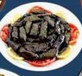 Warak Enab: Grape leaves stuffed with rice, vegetables and spices.